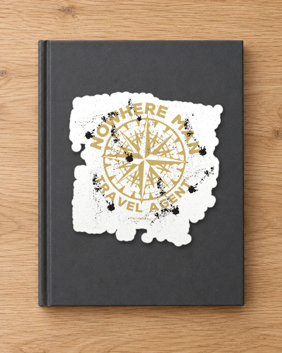 Compass Rose Travel Agent tee on a die-cut sticker