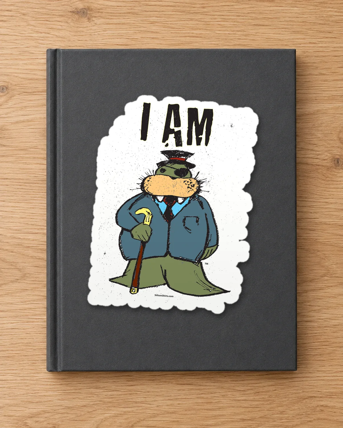 The Dapper Walrus tee on a die-cut sticker
