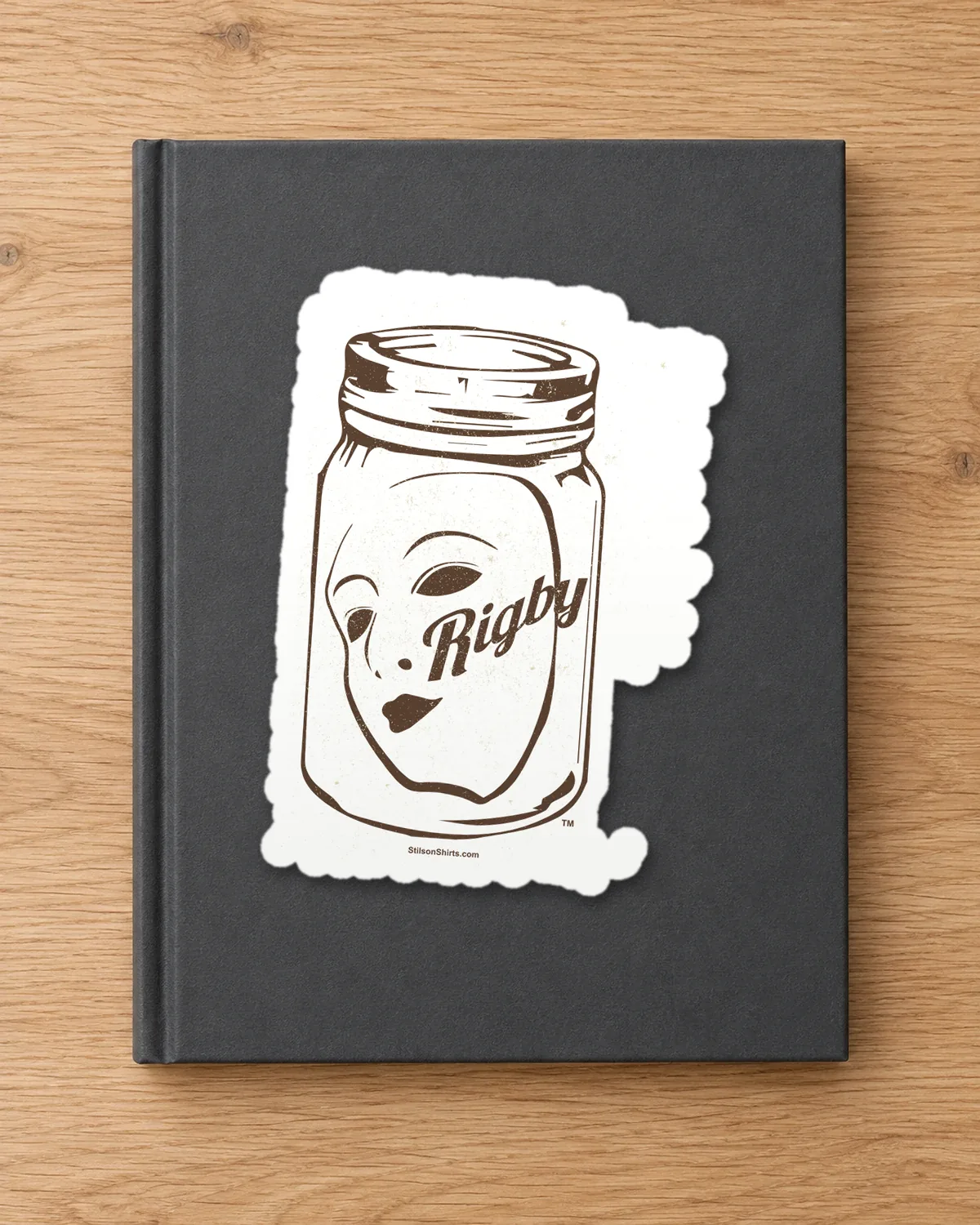 Face in a Jar tee on a die-cut sticker