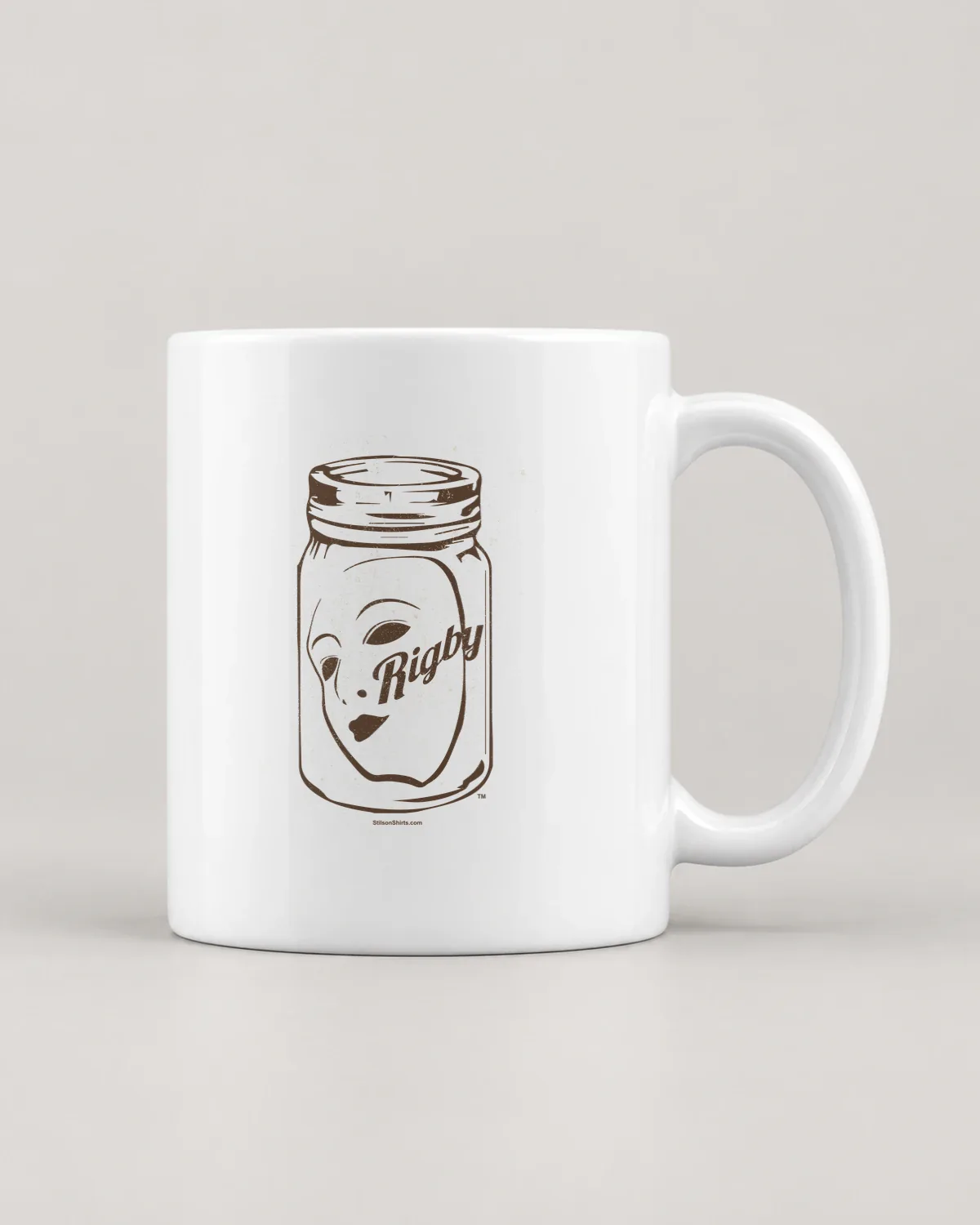 Face in a Jar tee on a ceramic mug