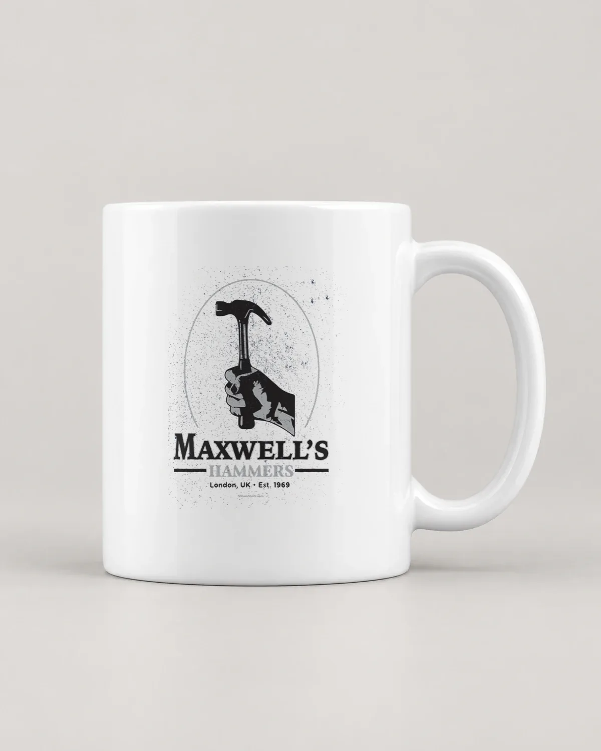 Hammer Works tee on a ceramic mug