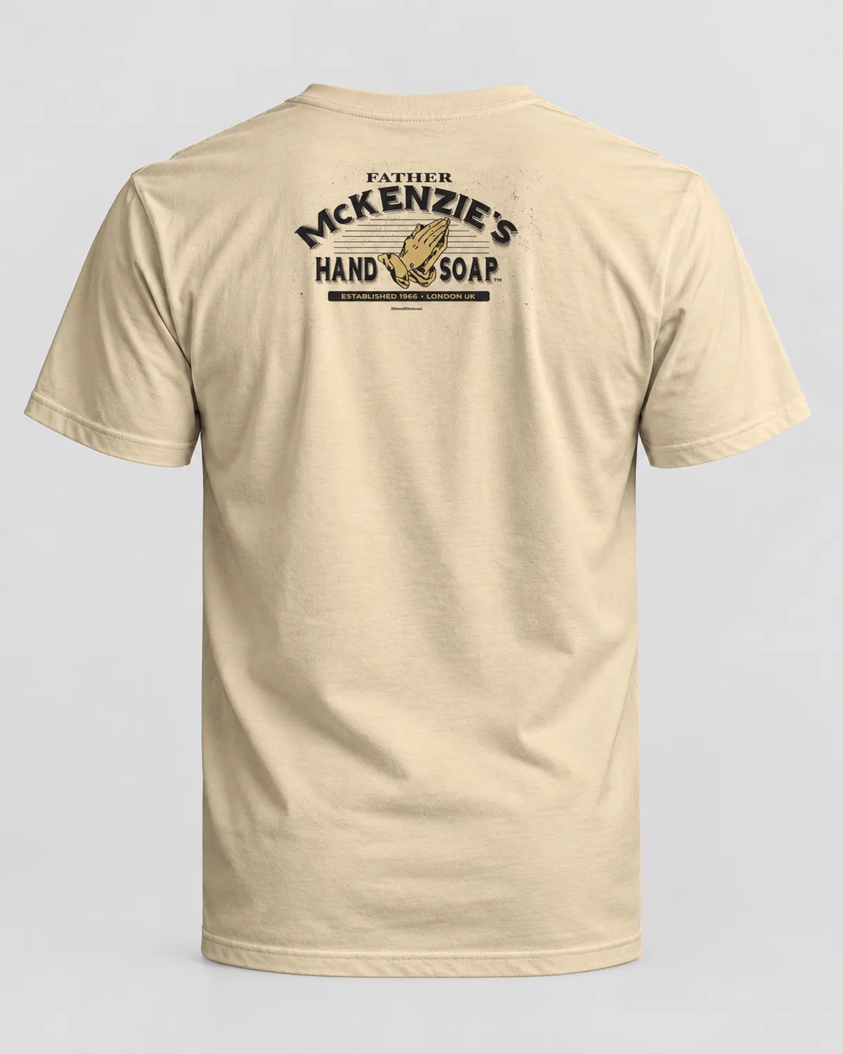 Praying Hands Soap Co. tee on a sand tee, back view