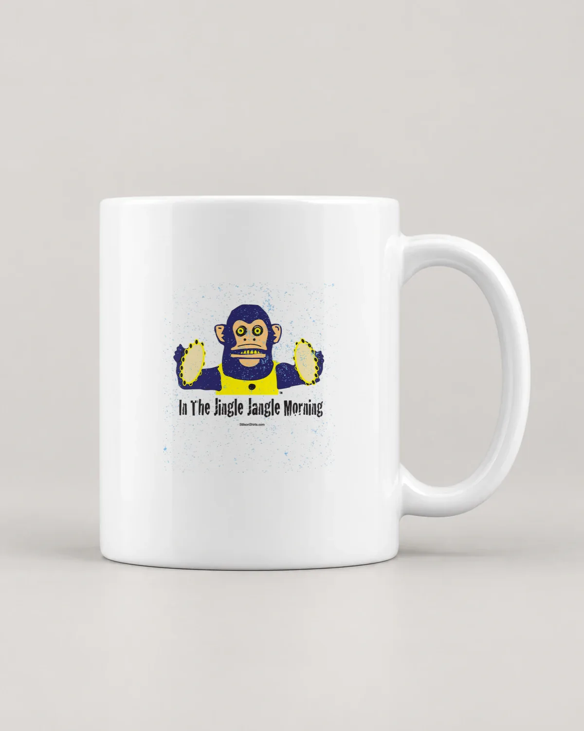 Cymbal Monkey Morning tee on a ceramic mug