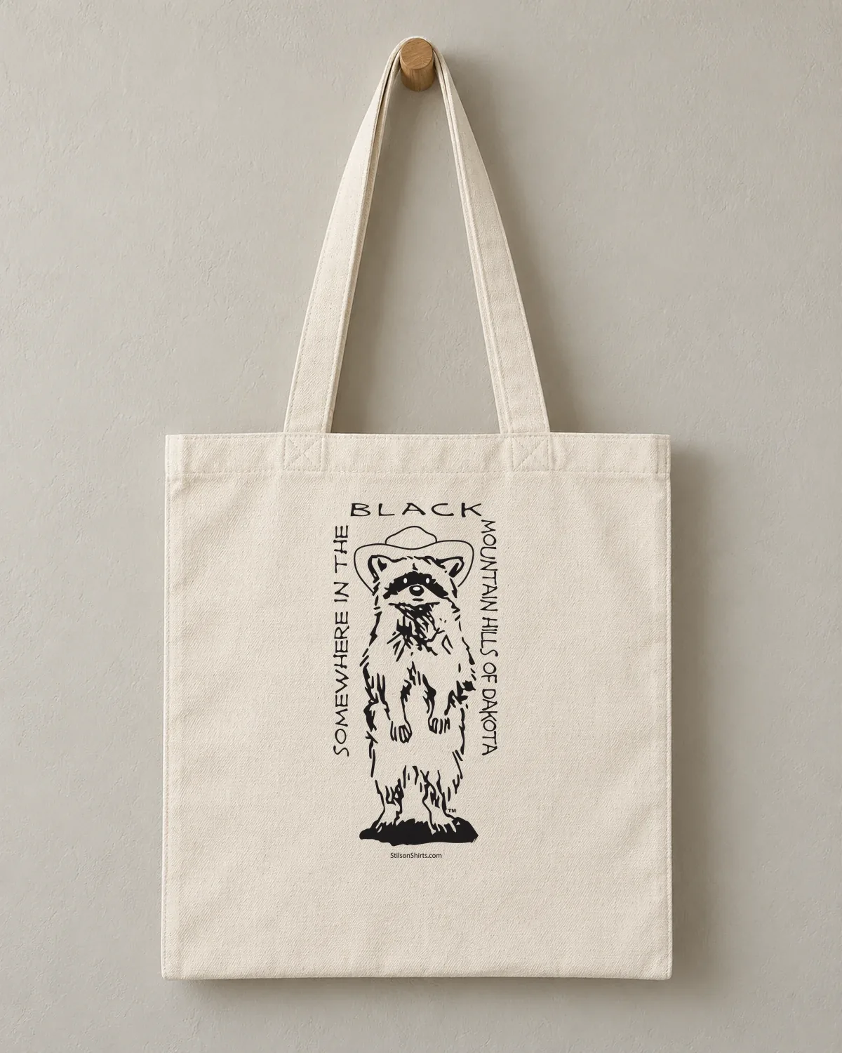 Mountain Raccoon tee on a cotton tote