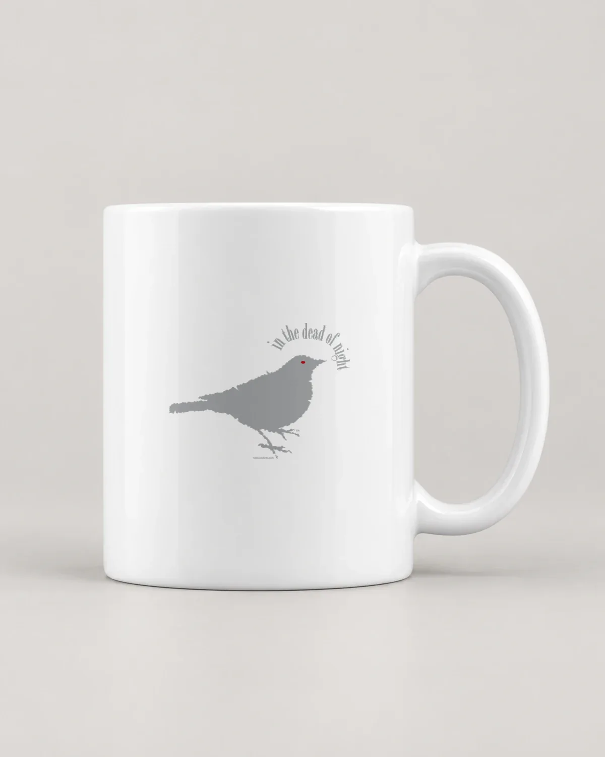 Night Bird tee on a ceramic mug