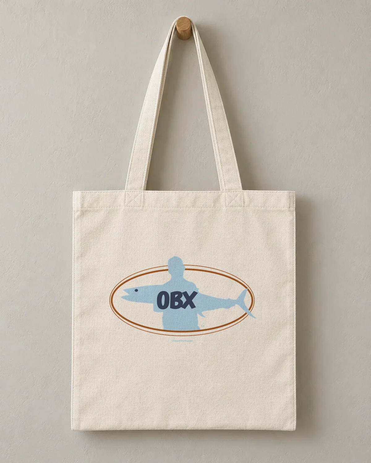 OBX Fish Oval tee on a cotton tote