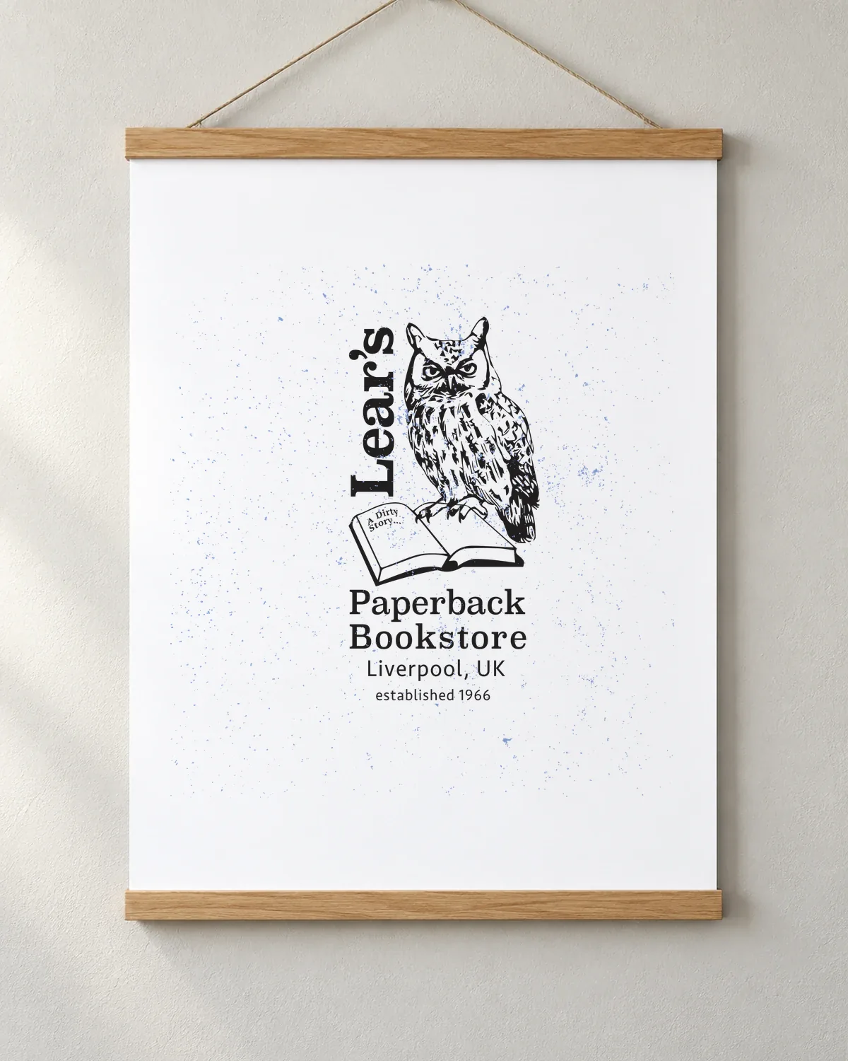Owl's Paperback Bookstore tee on a matte poster