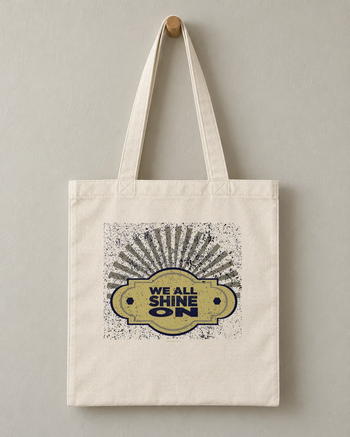 We All Shine On tee on a cotton tote