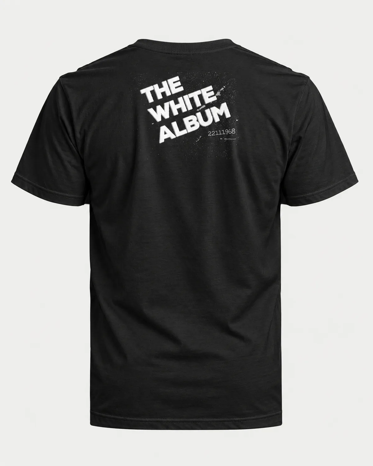 Tilted White Type tee on a black tee, back view